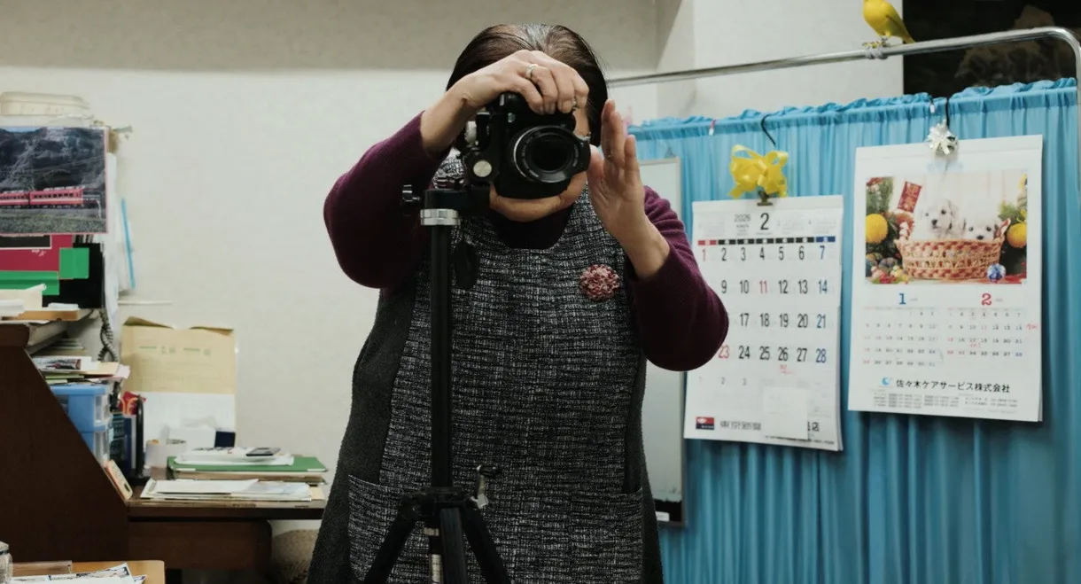 Masao Adachi Takes a Passport Photo