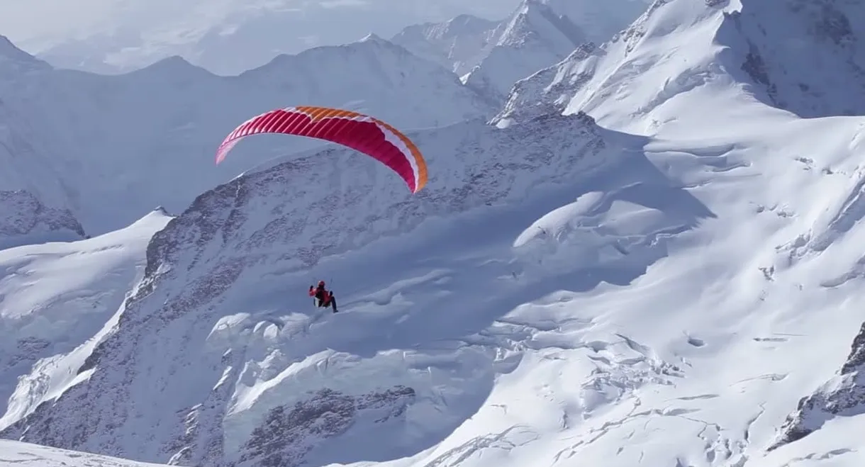 Ueli Steck - Paraglides Between Mountains In The Swiss Alps